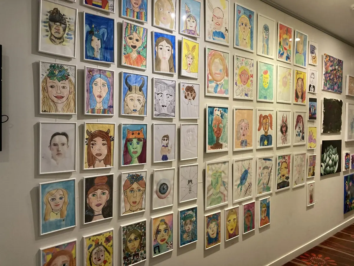 Student self-portraits framed and hung at the Currumbin RSL