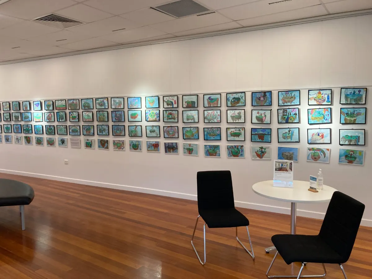 Ninety student works hung along the gallery wall